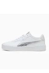 Championes Puma Carina 3.0, modelo deportivo para mujer en color blanco con franja lateral negra y suela de plataforma texturizada.