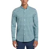 Camisa de manga larga con patrón de cuadros pequeños en tonos azul y celeste. Confeccionada en chambray con stretch, de calce regular y puños con botón.