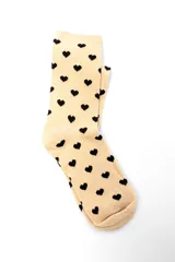 Pack de tres pares de medias crew con diferentes estampados: lunares blancos sobre fondo celeste, corazones negros sobre fondo beige y estrellas blancas sobre fondo negro.
