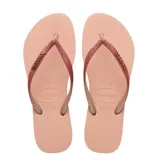 Sandalias tipo ojota Havaianas modelo Slim Glitter II, color beige arena. Presentan tiras finas con acabado de glitter brillante y logo de la marca en relieve.