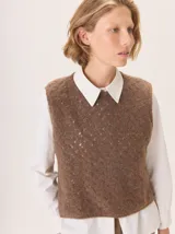 Chaleco de punto con textura calada, de cuello redondo y diseño sin mangas. Confeccionado en una mezcla de lana y mohair.