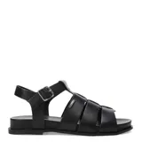 Sandalias tipo franciscanas de cuero gamuzado color marrón, con tiras anchas entrelazadas, cierre lateral con hebilla metálica y suela plana negra.