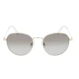 Lentes de sol de montura metálica redonda color dorado, con lentes polarizados degradados en tono gris. Las patillas son finas y terminan en acetato transparente.