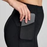 Calza larga de running Saucony Solstice, color negro, con cintura alta y bolsillos laterales.