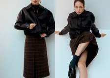 Falda midi de corte recto con diseño a cuadros en tonos marrones y negros, con una abertura frontal central.