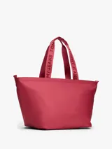 Cartera tipo tote de Tommy Jeans, confeccionada en poliéster con acabado liso. Presenta un compartimento principal con cierre de cremallera, asas superiores con la inscripción de la marca y el parche distintivo de Tommy en el frente.