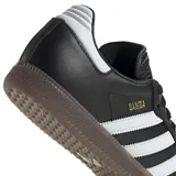 Championes Adidas Samba de mujer, color negro con detalles plateados y suela de goma translúcida.