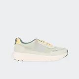 Championes Hey Dude modelo Sirocco Alta W Colorblock en color verde menta con detalles en amarillo y lila. Presentan una parte superior de nailon con puntera y talón de gamuza sintética, entresuela de EVA blanca y suela de goma ligera. Incluyen cordones elásticos, cuello acolchado y presilla en el talón para facilitar el calce.