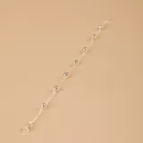 Pulsera de plata 925 compuesta por una cadena fina con pequeñas esferas intercaladas.