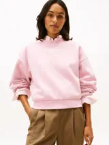 Buzo de cuello redondo Tommy Hilfiger color rosado, confeccionado en mezcla de algodón y poliéster reciclado, con mangas largas y logo bordado en el pecho.