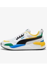 Championes Puma X-Ray, diseño multiclolour con base blanca, detalles en negro, amarillo, azul y verde, entresuela gruesa y suela de goma.