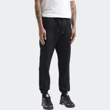 Pantalón de jogging negro con puños elásticos en los tobillos, cintura con cordón ajustable y bolsillos laterales con cierre.