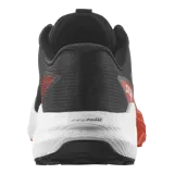 Championes Salomon Pulsar de trail running, color negro con entresuela en tono verde claro y negro, con amortiguación y suela de gran agarre.