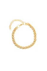 Pulsera dorada de acero quirúrgico con eslabones tipo espiga y cadena de extensión.