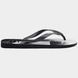 Ojotas Havaianas con base blanca y celeste con estampado de olas. Tiras blancas con diseño en relieve y logo de la marca.