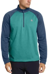 Buzo de cuello alto con cierre frontal parcial, diseño bicolor con cuerpo en color verde azulado y mangas raglán en azul marino. Presenta el logo de la marca bordado en el pecho.