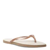 Sandalias tipo ojota Havaianas con base texturizada en color crema y suela marrón. Presenta tiras finas en color oro rosa con detalle de apliques brillantes.