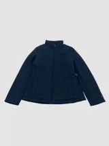 Campera acolchada de estilo quilt marca Tommy Hilfiger, color azul marino, con cuello alto, cierre frontal de cremallera y bolsillos laterales. Presenta un diseño de costuras cuadradas y detalles metálicos en los laterales de la cintura.