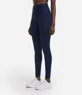 Calza legging deportiva de poliamida color azul con cintura alta de 10 cm.