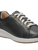 Championes Hush Puppies modelo Spinal Laceup de cuero color negro, con cordones grises, ojalillos metálicos dorados, entresuela gris y suela de goma.