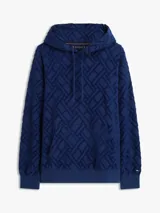 Buzo con capucha de Tommy Hilfiger, color azul marino, con patrón jacquard geométrico en relieve, bolsillo frontal tipo canguro y cordones ajustables en el cuello. Cuenta con puños y dobladillo acanalados, y detalle de la bandera bordada en el puño.