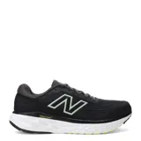 Championes de running New Balance Evoz Fresh Foam para hombre, color negro con entresuela blanca y suela negra con detalles amarillos. Presentan el logotipo 'N' en los laterales en color verde claro y tecnología Fresh Foam en la entresuela para mayor amortiguación.