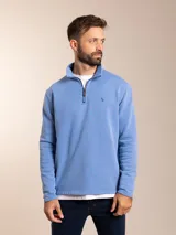 Sweater celeste de algodón y poliéster con cuello alto y cierre parcial con cremallera.
