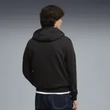 Buzo con capucha negro de la colección Aston Martin Aramco Formula One Team, confeccionado en colaboración con Puma. Presenta el logo de Aston Martin, Aramco y el logo de Puma estampados en el frente, con cordones ajustables en color amarillo neón.