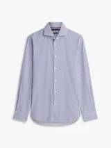 Camisa de manga larga de Tommy Hilfiger, con diseño de rayas verticales azules y blancas, cuello rígido y cierre frontal con botones.