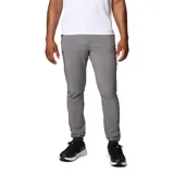 Pantalón gris Columbia modelo Triple Canyon P Ii, con tecnología Omni-Shade y Omni-Shield, diseñado para senderismo. Cuenta con bolsillos con cremallera y puños ajustables.