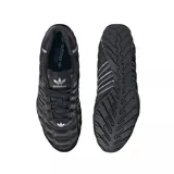Championes adidas Adi Racer Low de diseño deportivo, color negro con textura acolchada en forma de rombos. Presenta las tres tiras características de la marca en color plateado y detalles metálicos en el talón y la suela.
