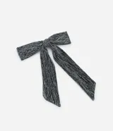 Pinza para el pelo con forma de lazo, revestimiento brilloso y apliques de strass.