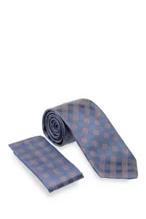Corbata verde oscuro con estampado floral y pañuelo de bolsillo a juego.