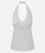 Blusa Blue Steel de bengalina con estampado de lunares, diseño frente única con escote profundo y espalda abierta. Presenta un recorte bajo el busto con efecto peplum que aporta volumen y estructura a la prenda.