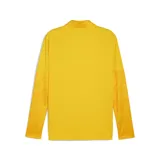 Camiseta de entrenamiento Puma color amarillo con cierre corto, escudo del Club Atlético Peñarol y logo de Puma estampados en negro.