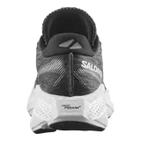 Championes de running Salomon Aero Glide 4, color negro con suela blanca alta y amortiguada. Presenta capellada de malla transpirable sin costuras y el nombre de la marca impreso en el lateral.
