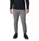 Pantalón técnico Columbia de corte ajustado, color gris, con paneles de diferente tonalidad en la parte inferior. Cuenta con cintura elástica ajustable con cordón y puños elásticos en los tobillos.
