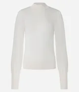 Suéter negro de punto con cuello alto, mangas largas abullonadas y puños largos.