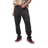 Pantalon de jogging Nike Jordan, confeccionado en tejido fleece color negro, con cintura elástica ajustable mediante cordón, puños elásticos en los tobillos y logo Jumpman bordado en color rojo en la pierna izquierda.