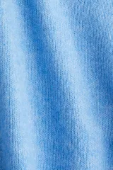 Buzo de punto azul celeste, corte holgado y corto, con cuello redondo y mangas cortas. Presenta un acabado suave y cepillado.