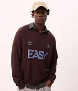 Suéter de punto en jacquard color bordó con diseño de cuello polo y cierre frontal parcial. Presenta estampado frontal con la palabra 'EASY' y la frase 'plans being' en color celeste, además de un pequeño logo bordado. Posee mangas largas con puños acanalados y un corte holgado.