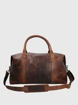 Bolso de viaje Hush Puppies confeccionado en cuero natural con acabado envejecido. Cuenta con compartimento principal con cierre, bolsillo frontal de fácil acceso, doble asa superior y correa ajustable y removible. Incluye forro interior de poliéster reciclado.