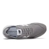 Championes New Balance modelo MSX70CA, color gris con detalles en blanco. Presentan una capellada de gamuza y textil, con el logo 'N' en blanco en el lateral y una entresuela blanca texturizada.