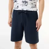 Bermuda azul marino de felpa ligera con cintura elástica ajustable mediante cordón y bolsillos laterales.