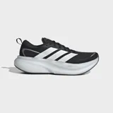 Championes de running Adidas Supernova Glide, color negro con las tres tiras características en blanco en los laterales y suela de plataforma amortiguada blanca. Confeccionados con exterior textil liviano y suela de caucho.