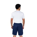 Remera deportiva azul marino de manga corta, corte ajustado y logo de Umbro estampado en el pecho.