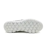 Championes Caterpillar modelo Hex Lite, color azul marino, confeccionados en cuero flor con detalles textiles. Presentan suela de EVA liviana con diseño hexagonal y cierre mediante cordones.