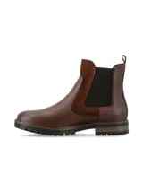 Botineta Chelsea de cuero marrón con textura símil reptil, paneles laterales elásticos en negro y detalles en gamuza. Cuenta con suela dentada de goma.