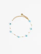 Pulsera dorada de acero quirúrgico con dijes de ojitos turquesas de cerámica.