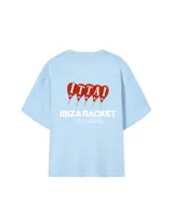 Remera color crema de corte oversize con estampado en la espalda que incluye cuatro paletas de pádel rojas con la palabra 'ITTAI' perforada, y texto debajo que dice 'IBIZA RACKET ITTAI STARS'.